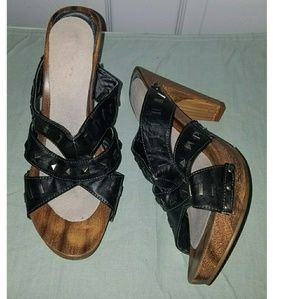 4.7 inch wooden black studded strap slip on heels.